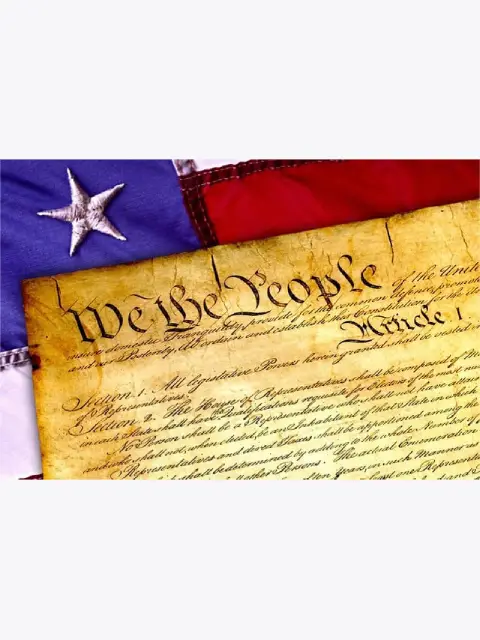2 3rd An aged document with "We the People" at the top, partially draped by the American flag, symbolizing U.S. democracy and governance.
